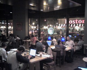 A crowded Starbucks cafe, filled with Internet users